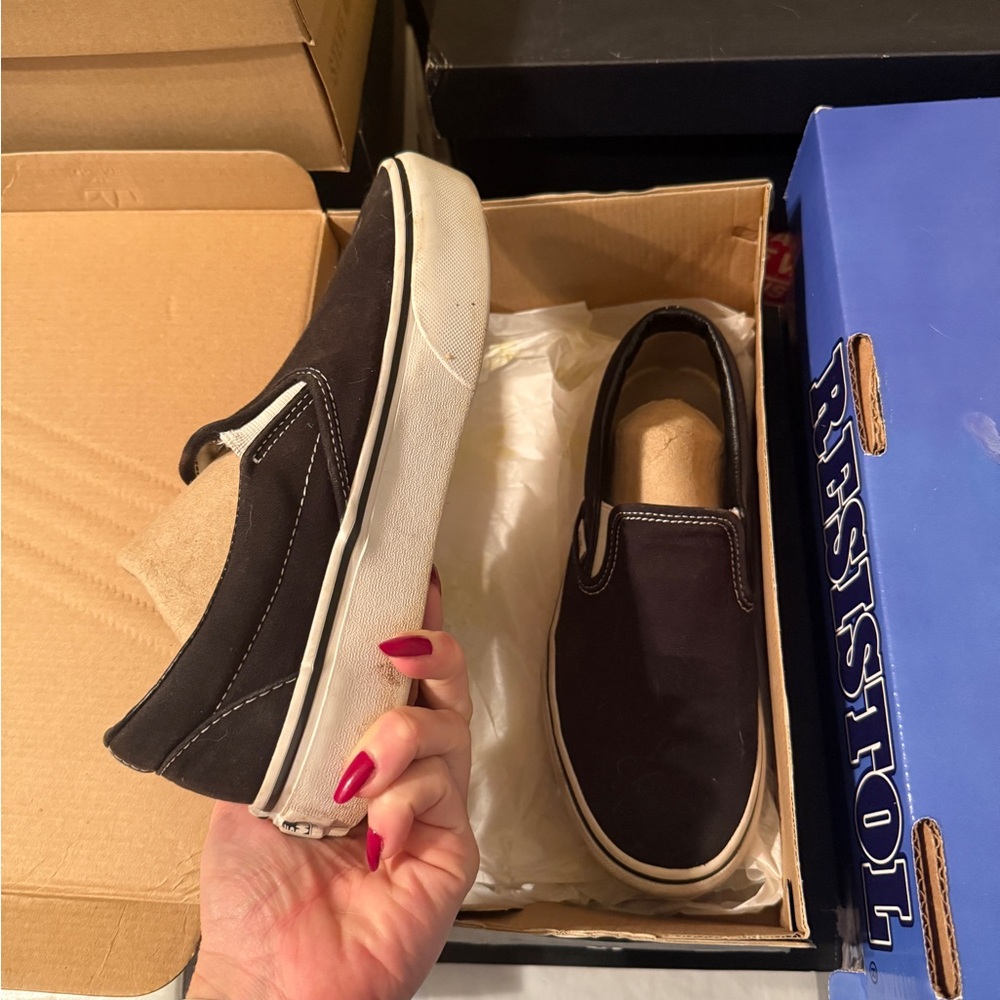 Vans Black and White Slip-On Sneakers